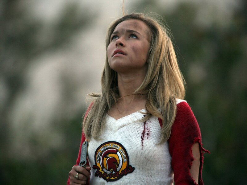 Girl in torn sweater looking up