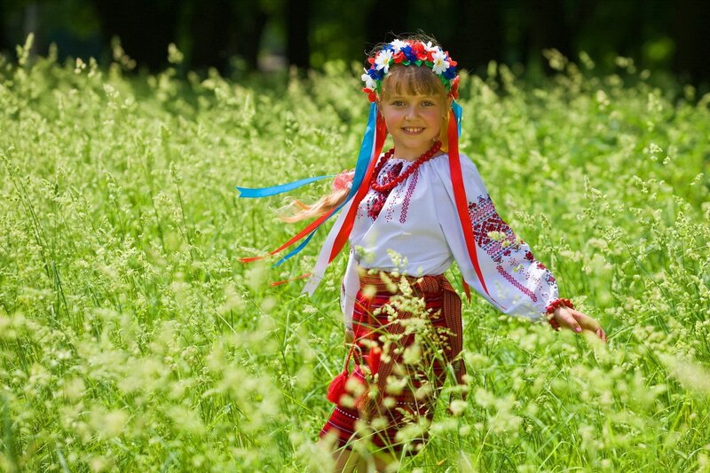 Girl in traditional dress in field