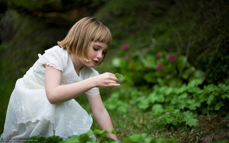 Girl in white dress in garden
