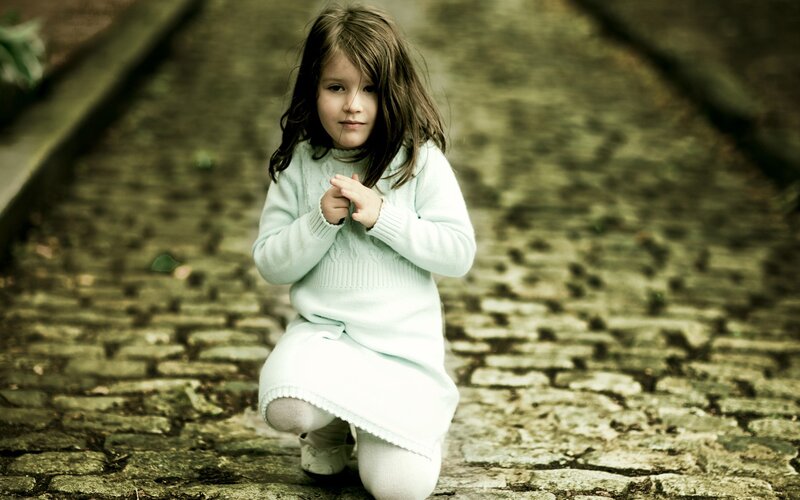 girl in white dress kneeling