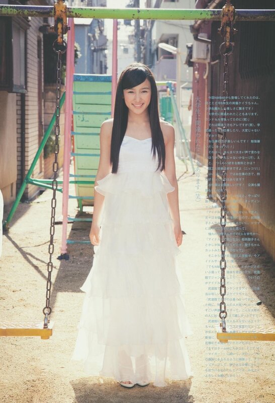 Girl in white dress on swing
