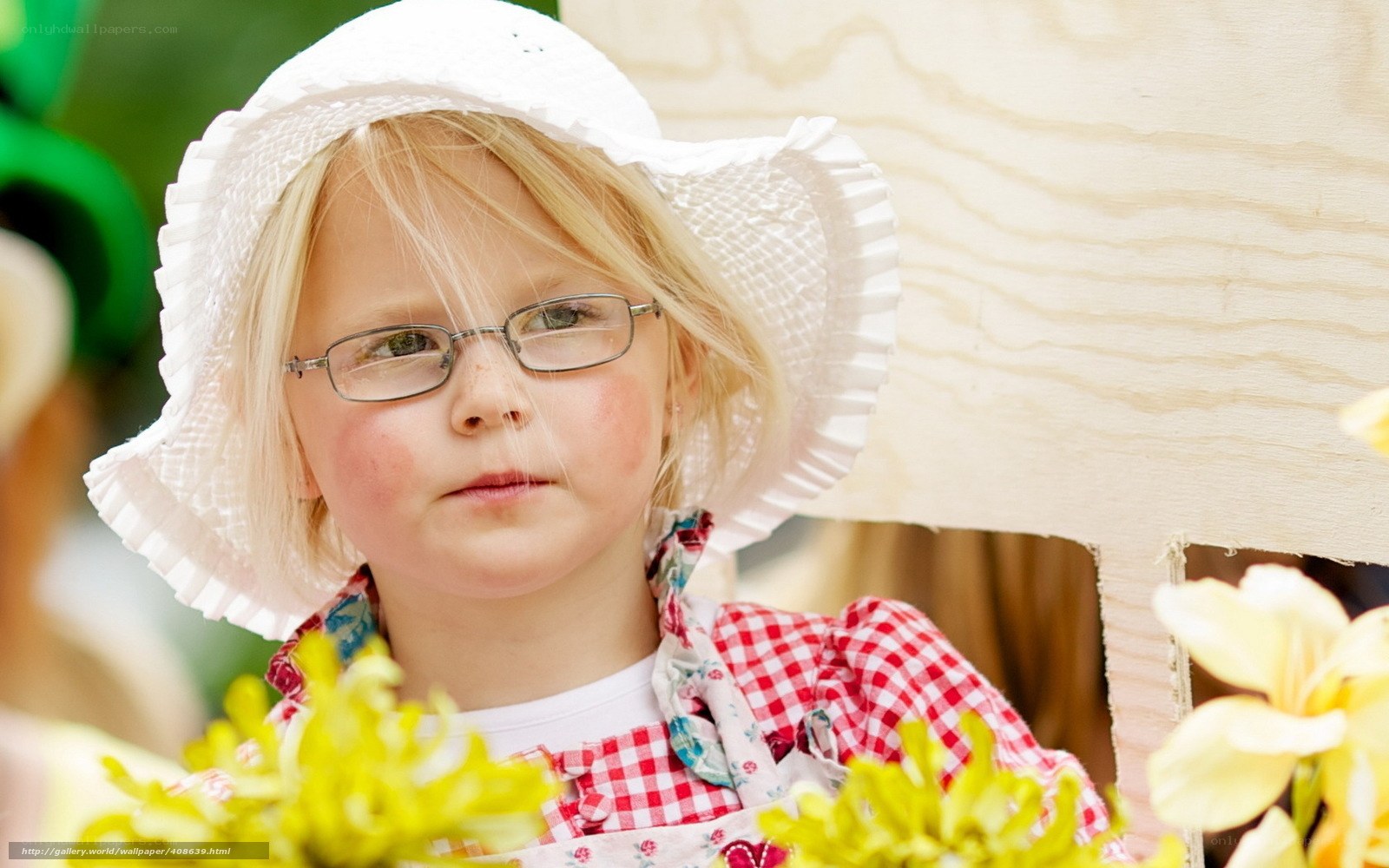 girl in white hat and glasses