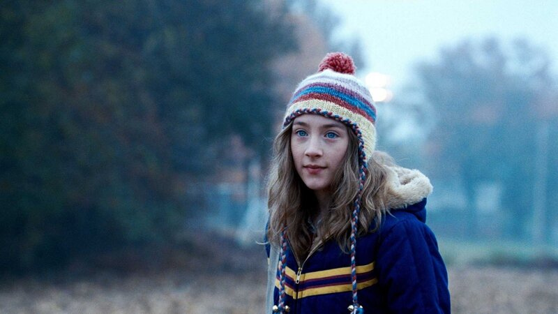 girl in winter hat and coat