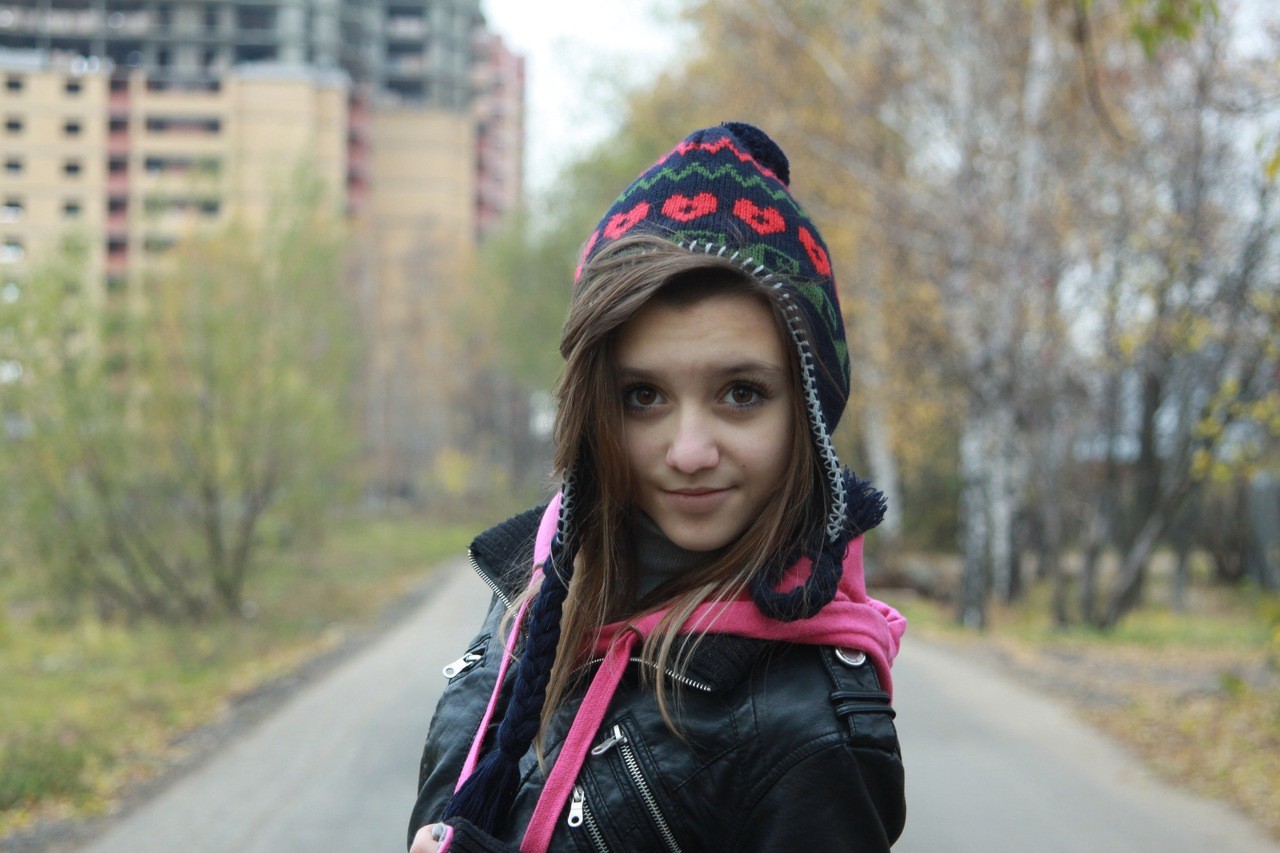 girl in winter hat on path