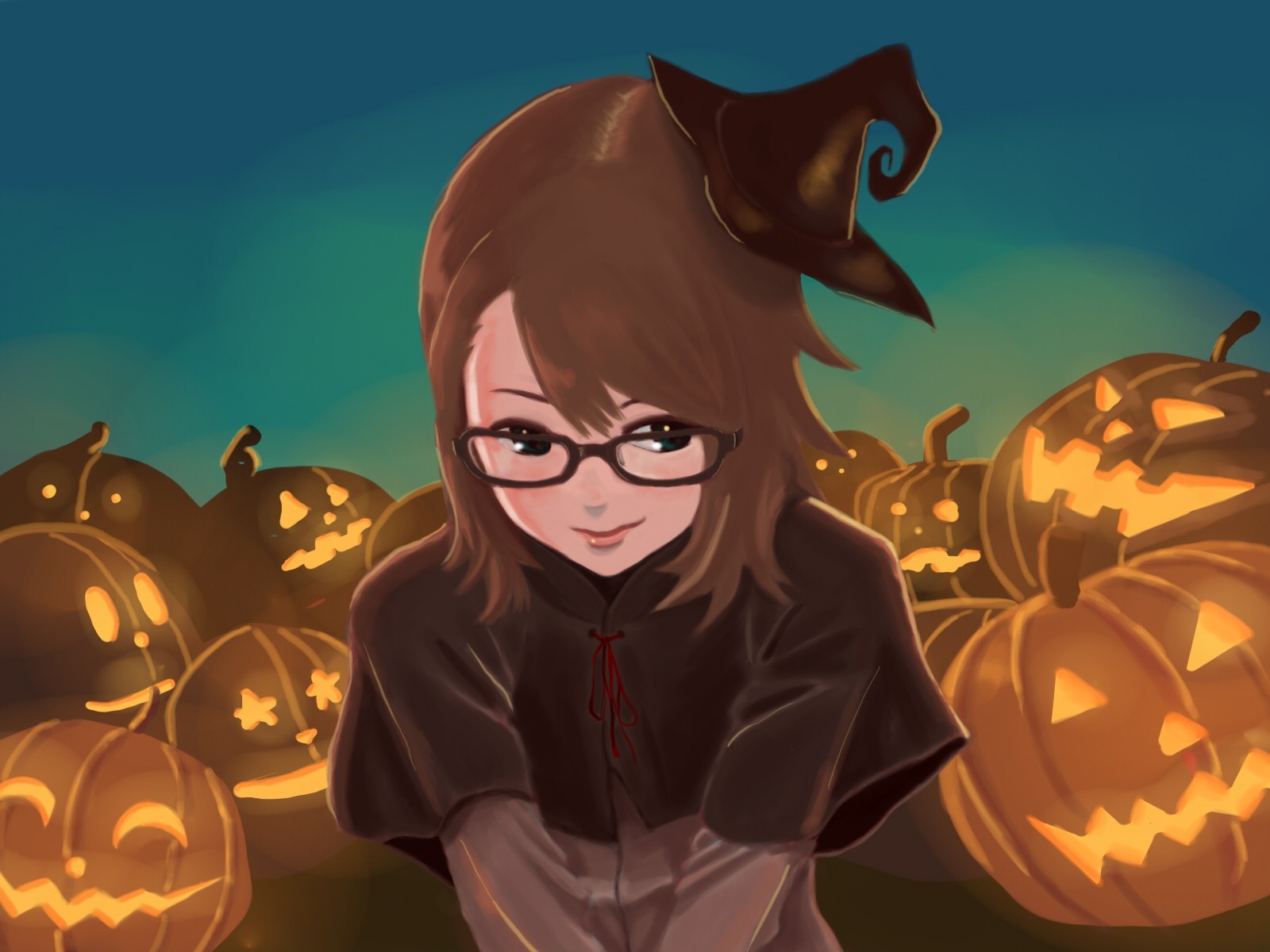 girl in witch costume with pumpkins