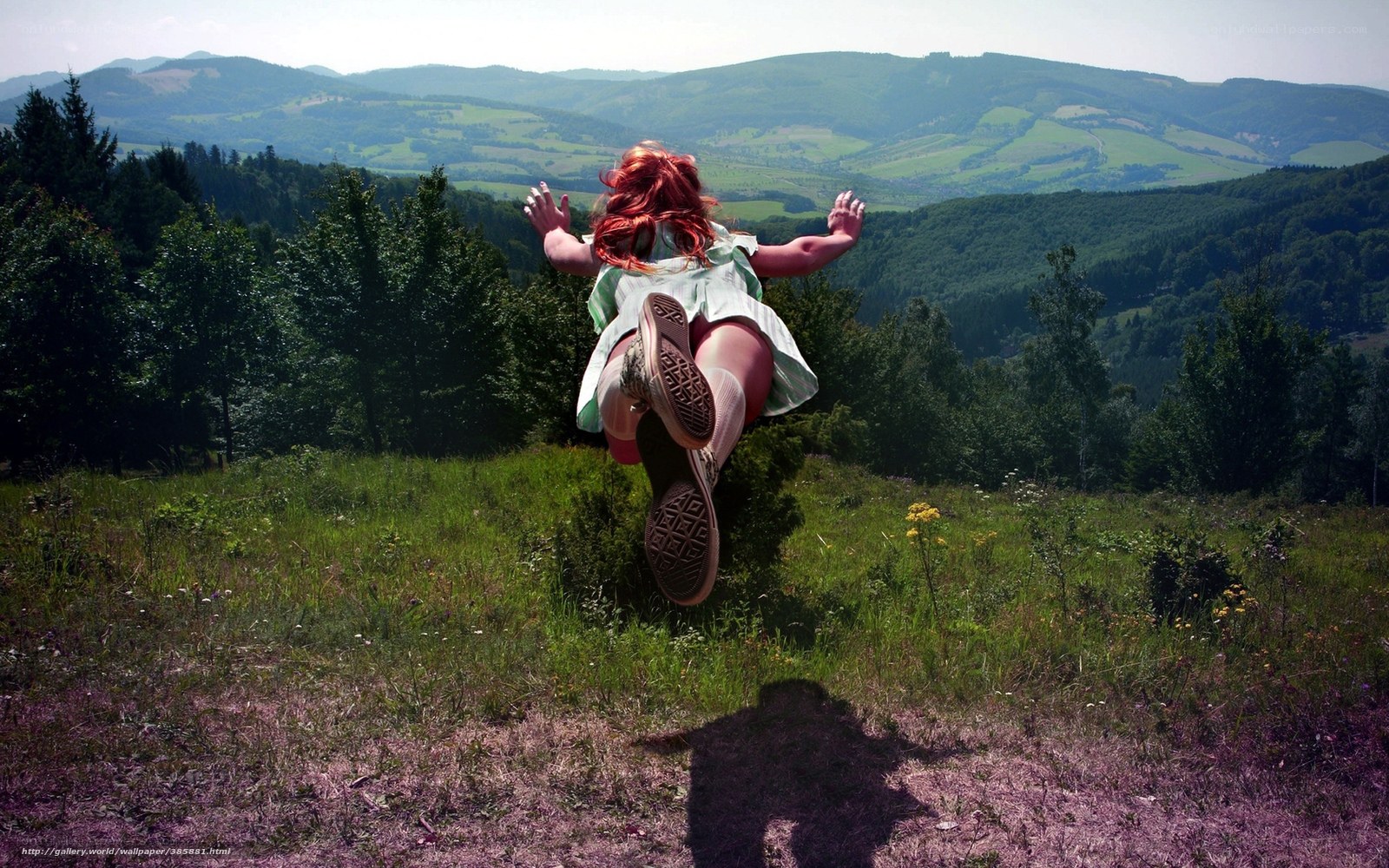 Girl jumping in a field