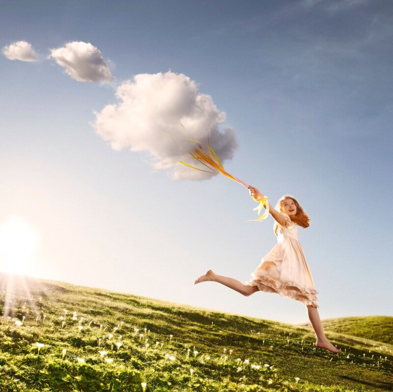 Girl Jumping in Field