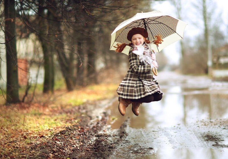 Girl Jumping in Puddle