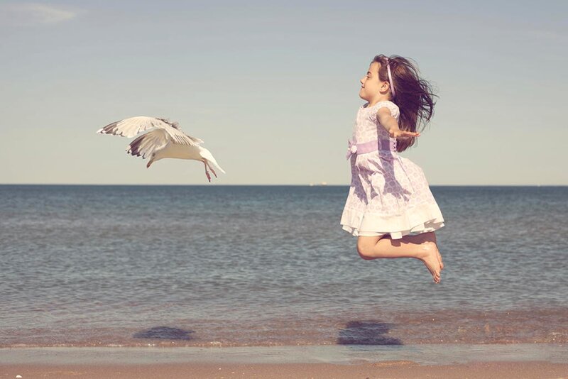 Girl Jumping on Beach — Blue