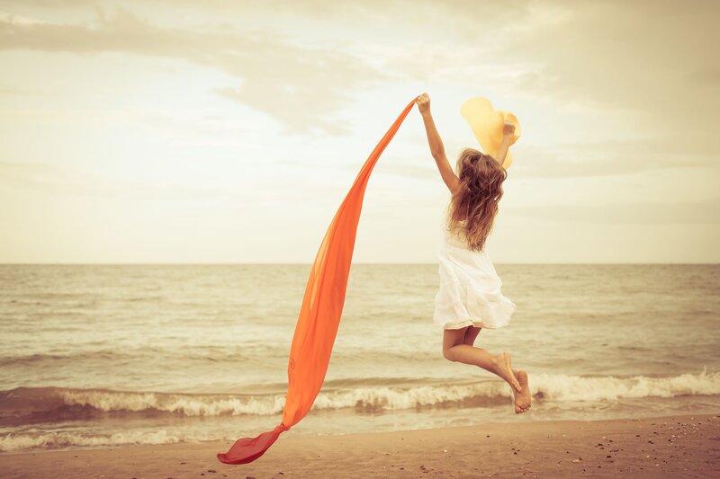 Girl Jumping on Beach — Orange