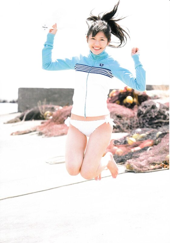 girl jumping on beach