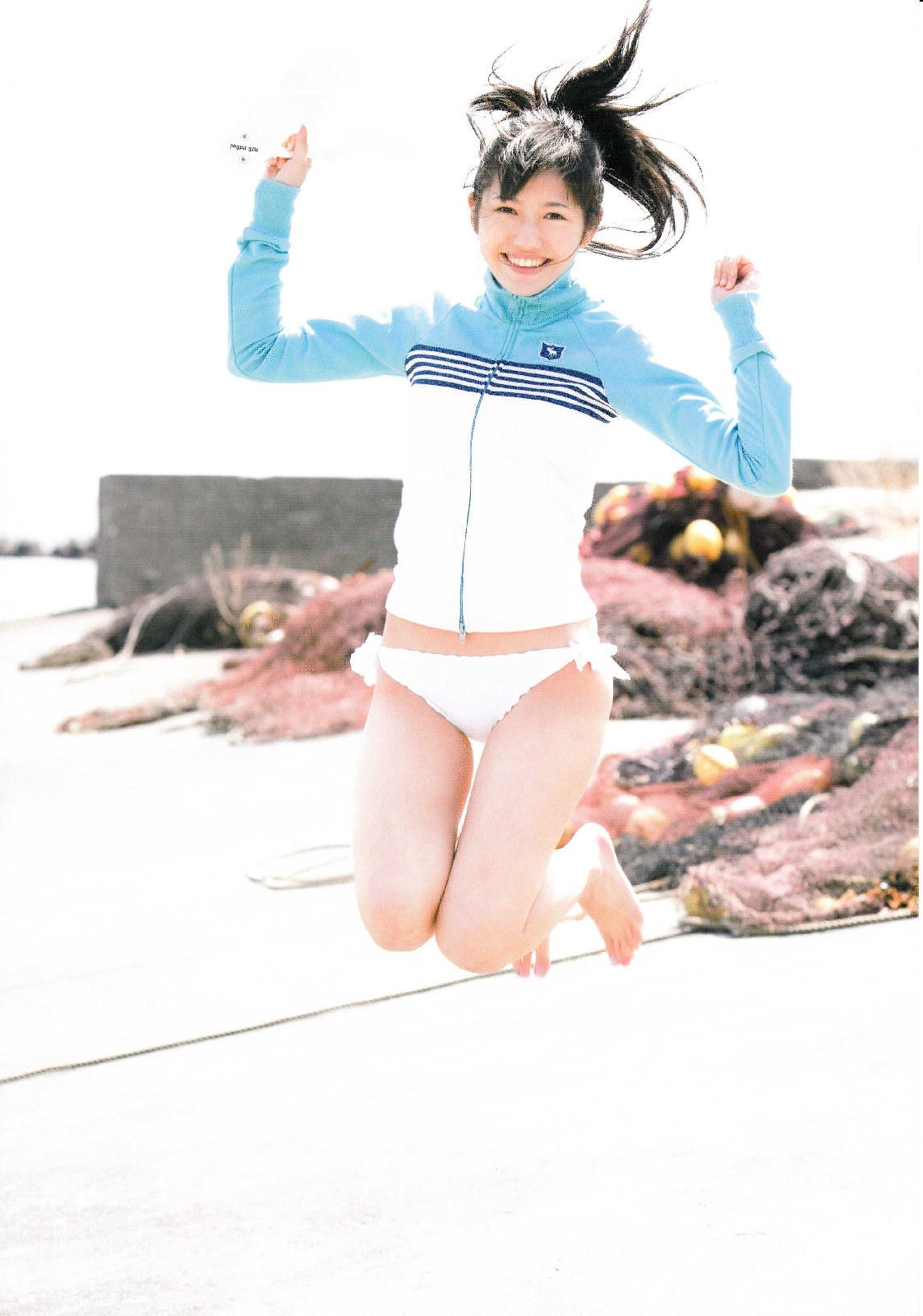 girl jumping on beach