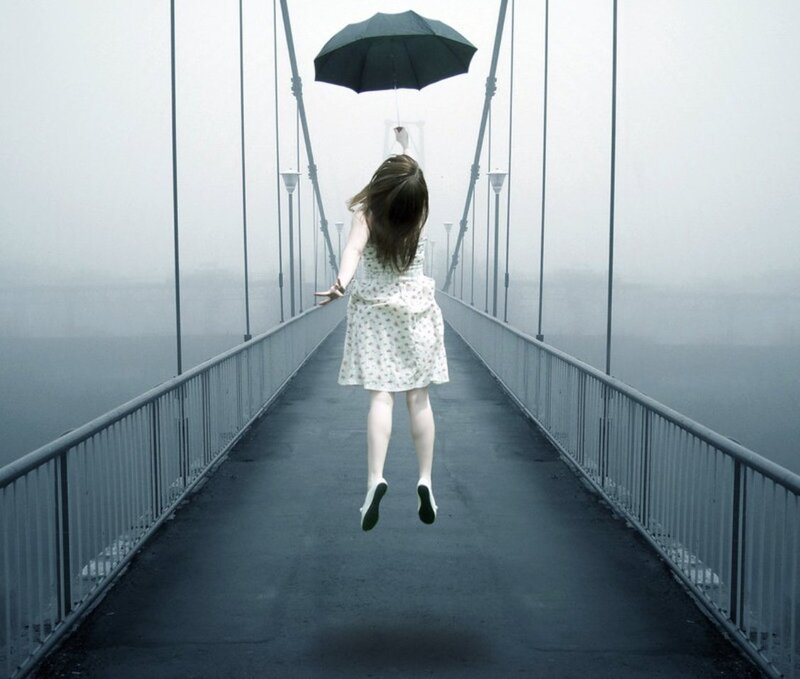 Girl Jumping with Umbrella