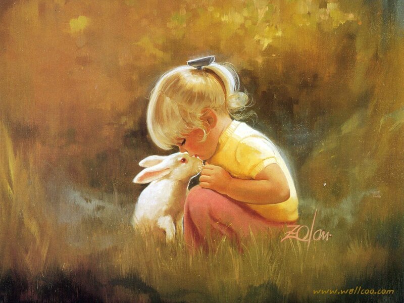Girl kissing a white rabbit