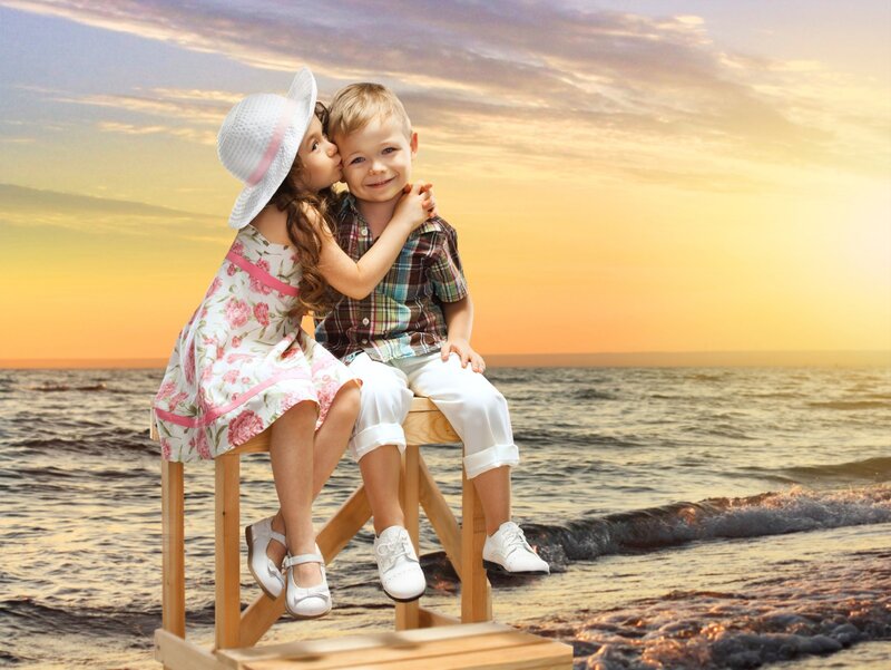 Girl Kissing Boy on Beach