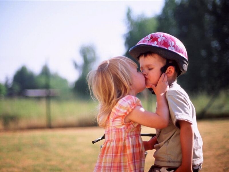 Girl Kissing Boy on Cheek