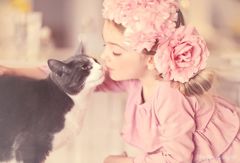 Girl Kissing Cat