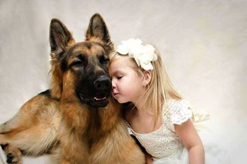 Girl Kissing German Shepherd