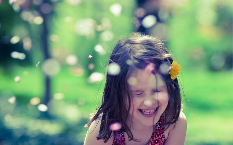 girl laughing in park
