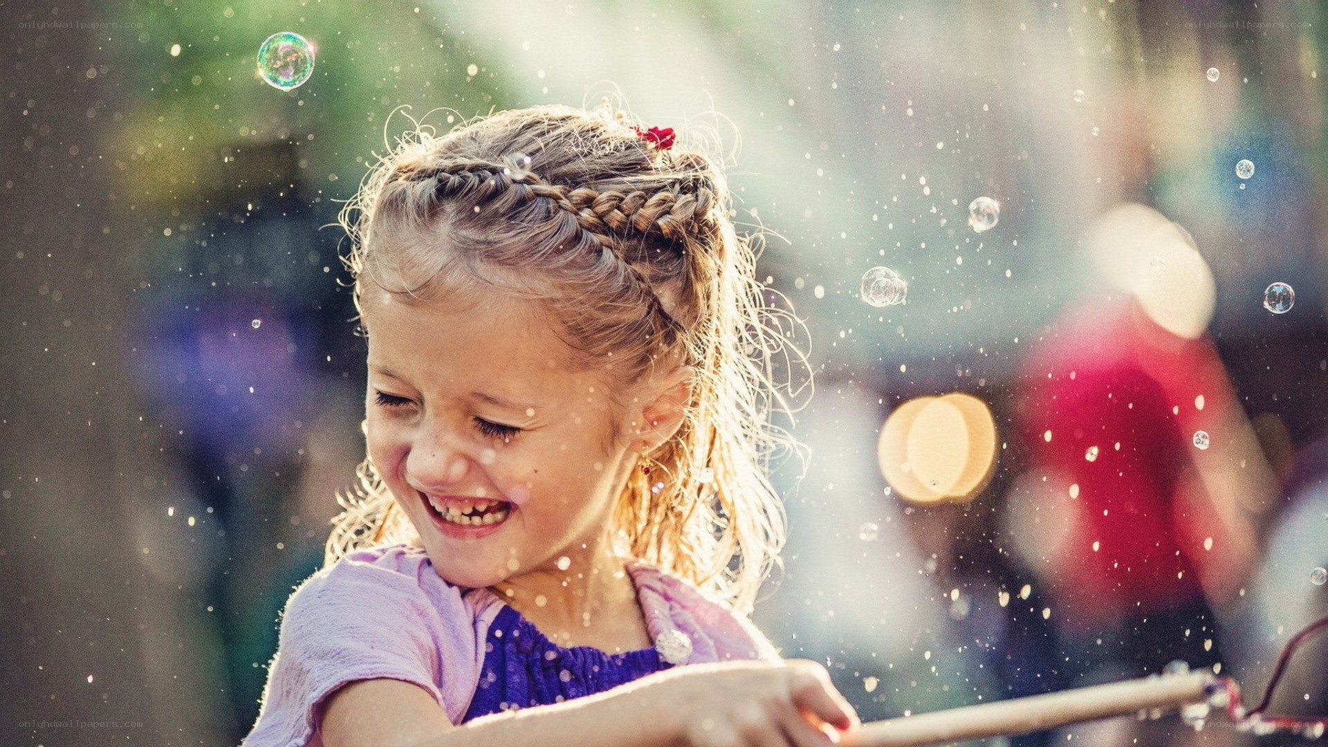 Girl laughing with bubbles