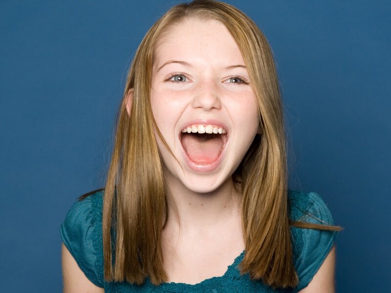 girl laughing with mouth open