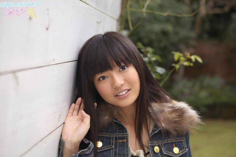 girl leaning against a wall