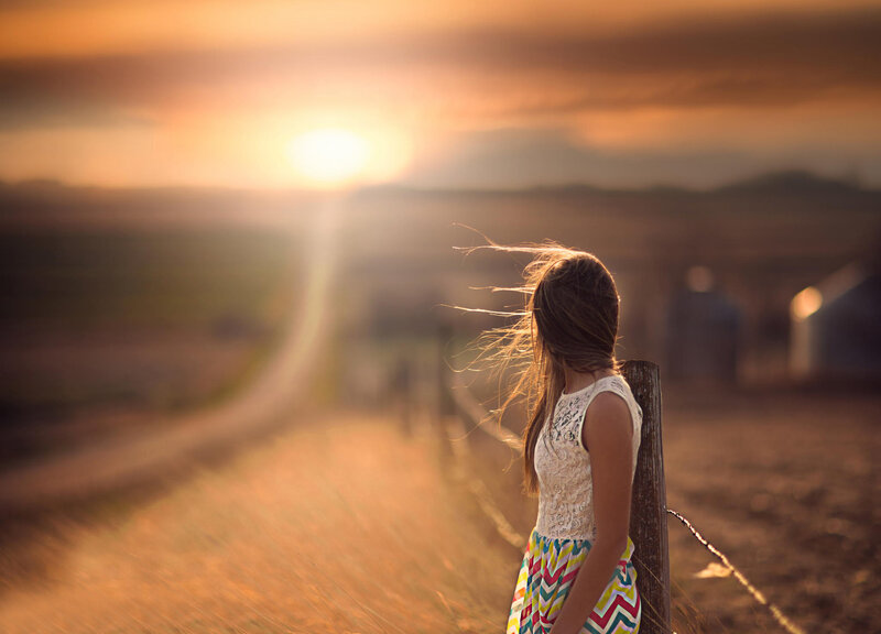 Girl Leaning on Fence — Gold