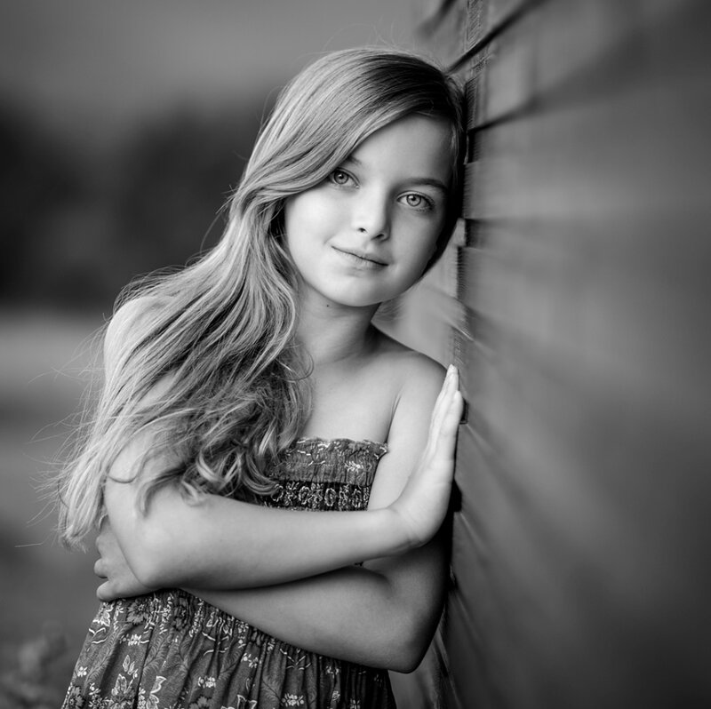 Girl Leaning on Wall