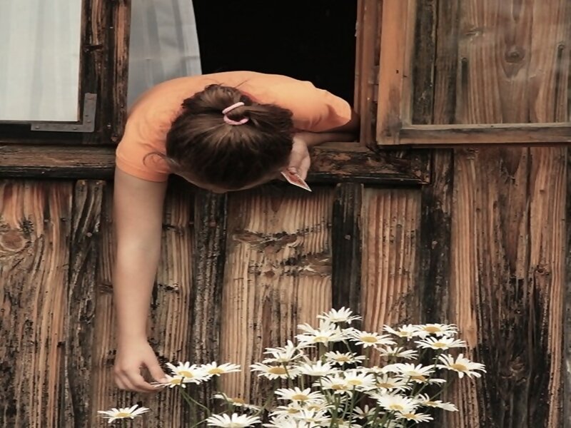 Girl Leaning Out Window