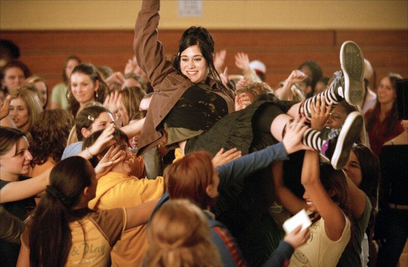 Girl lifted in crowd celebration