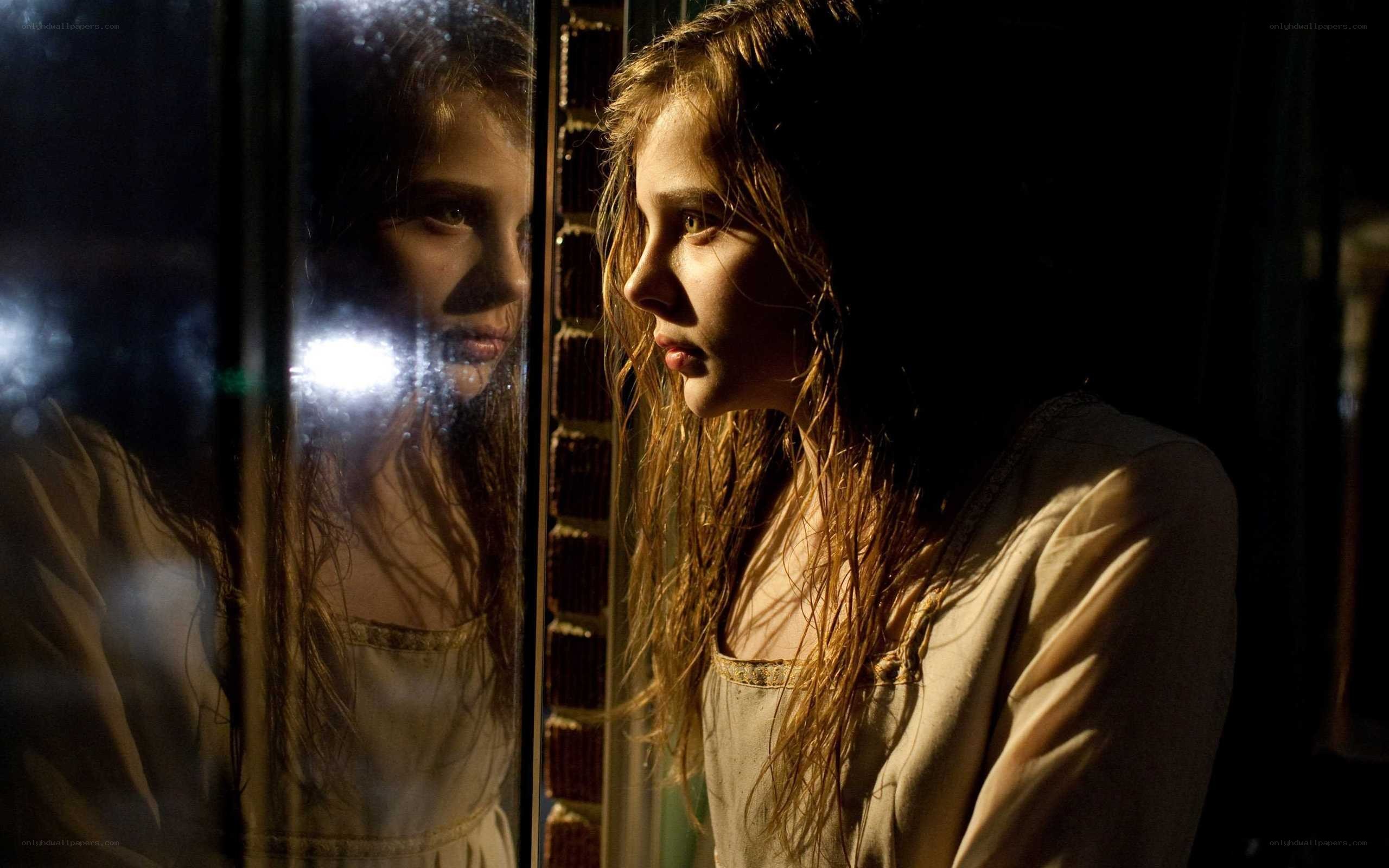 girl looking at her reflection