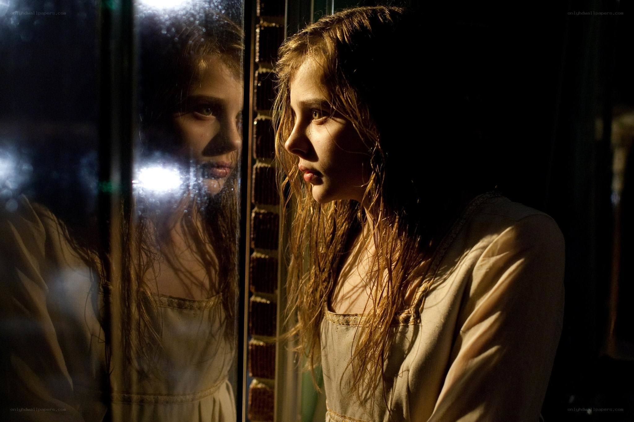 girl looking at her reflection