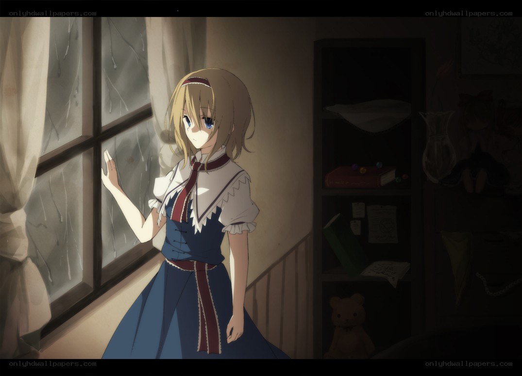 girl looking out rainy window