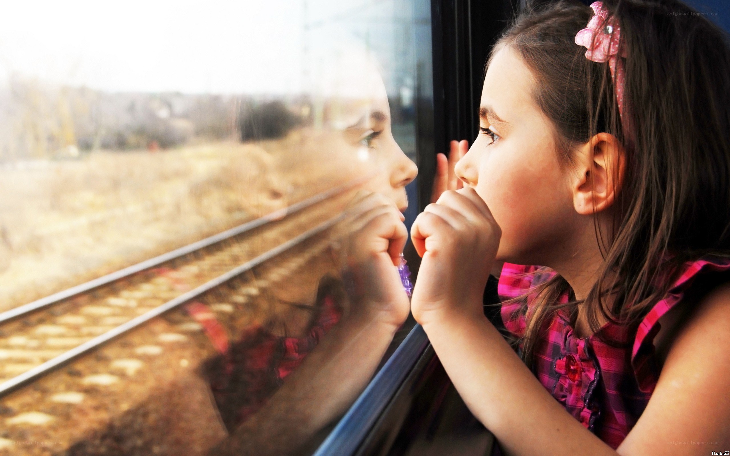 girl looking out train window