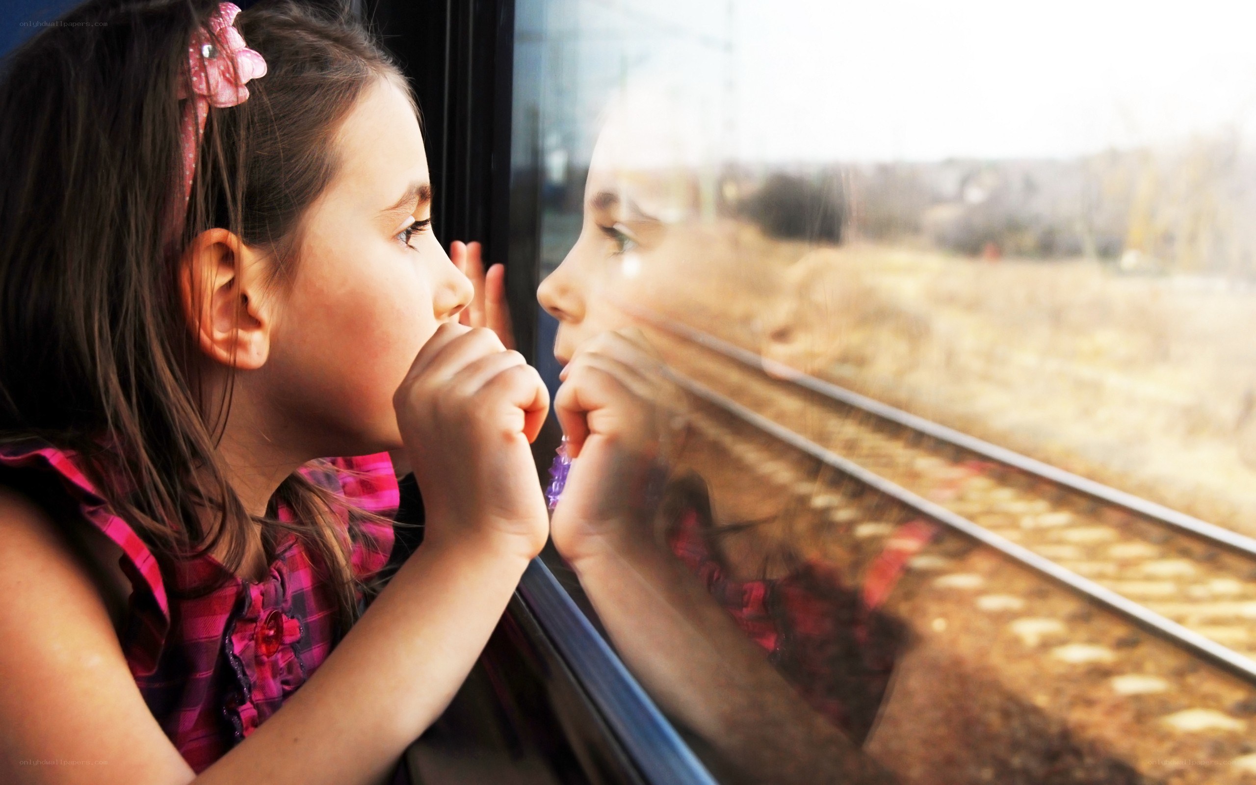 girl looking out train window