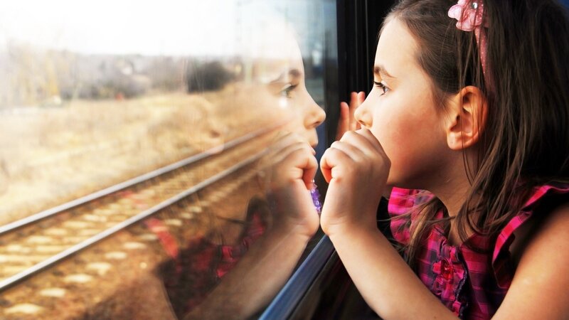 Girl Looking Out Train Window — Pink