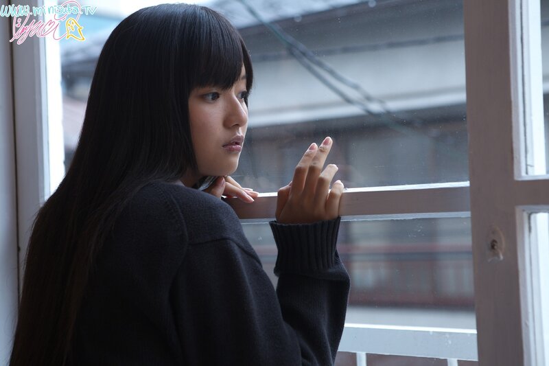 girl looking out window