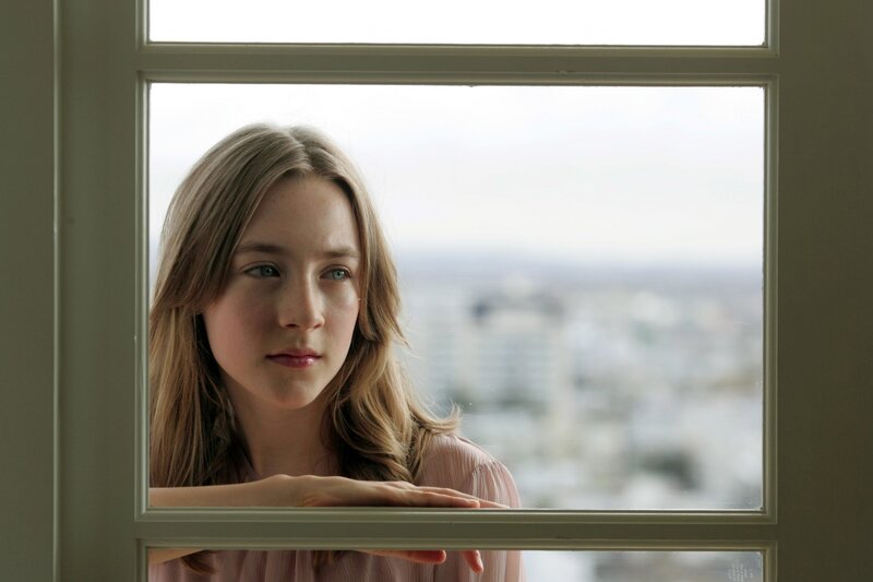 girl looking out window