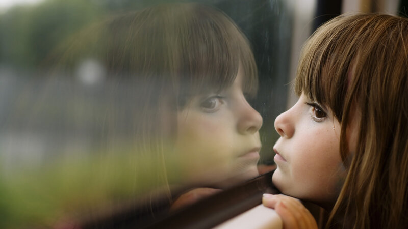Girl Looking Out Window — Brown