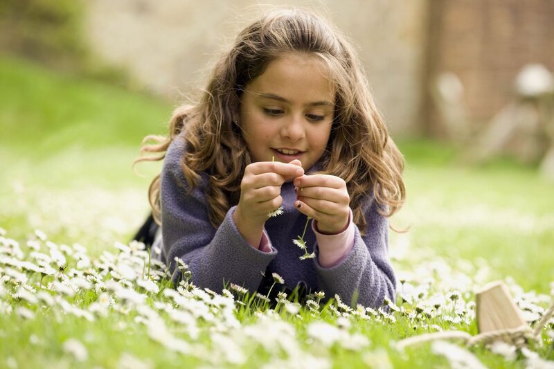 Girl Lying in Daisies