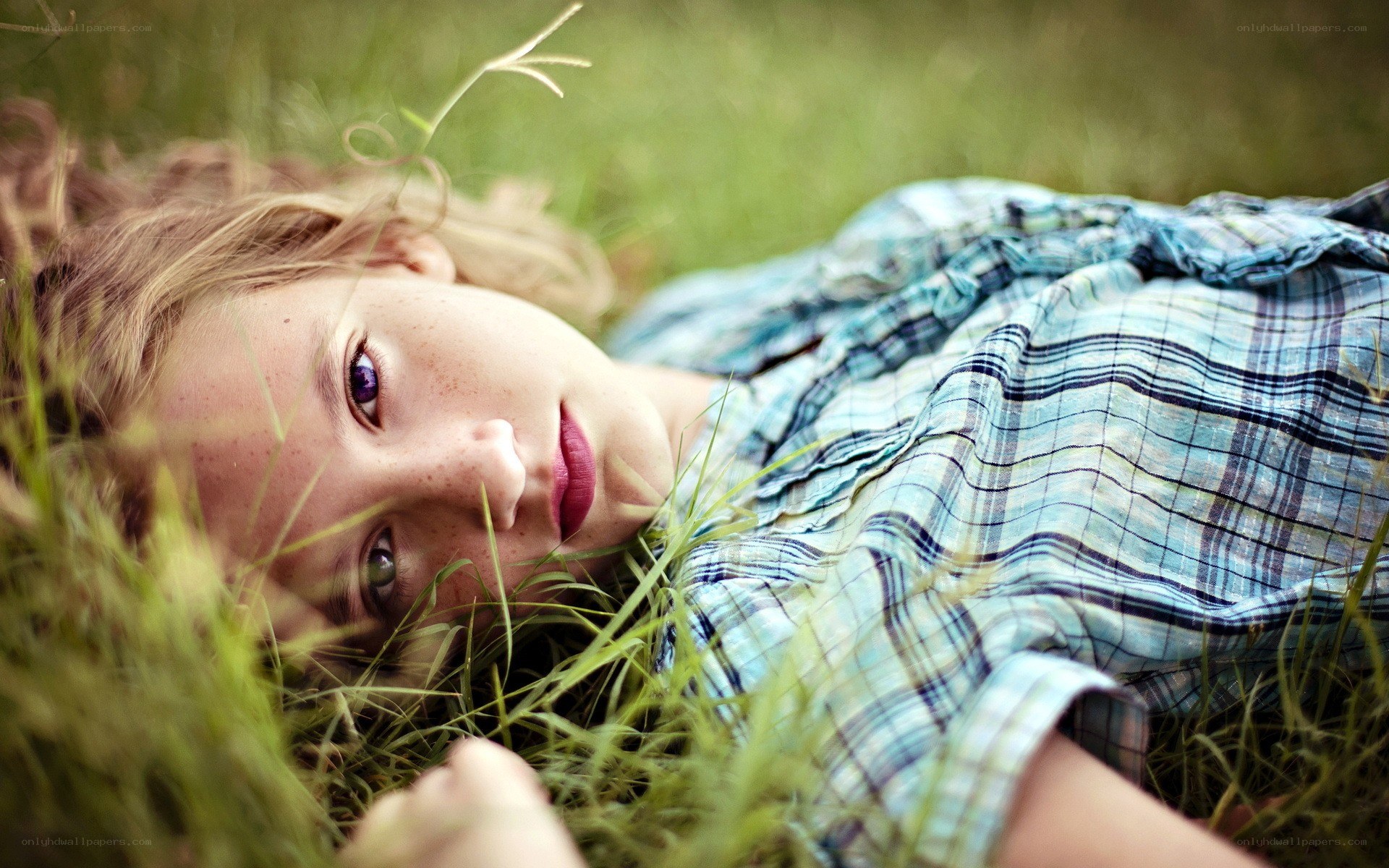 girl lying in grass