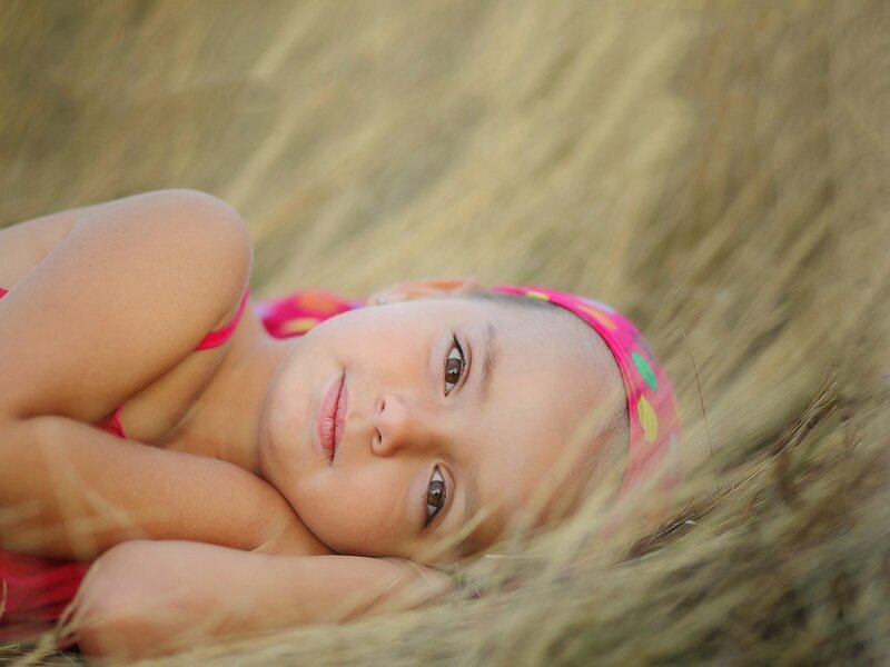 Girl Lying in Grass — Pink, Calm