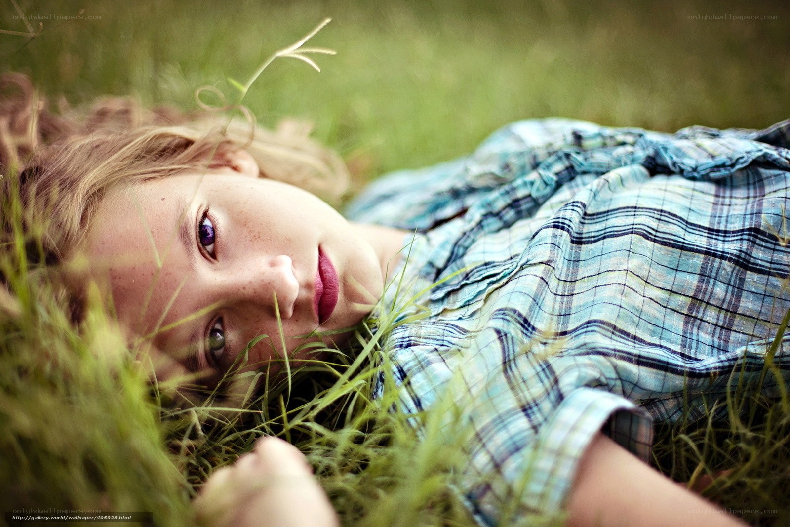 girl lying in grass