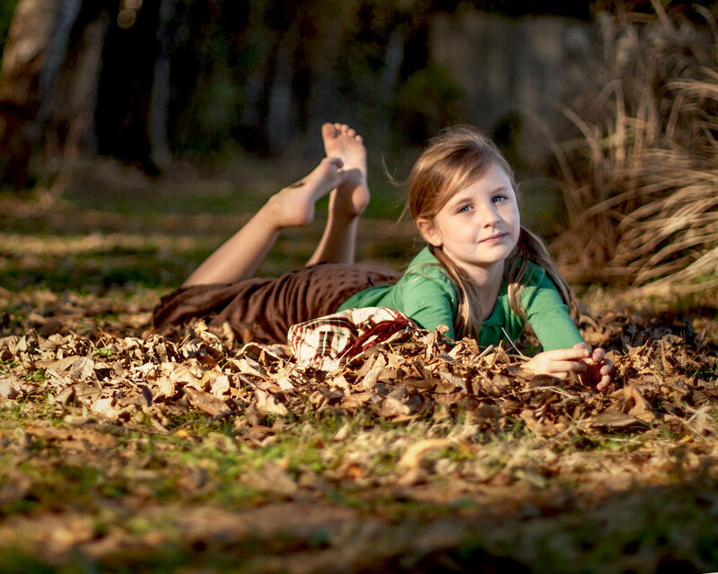 Girl Lying in Leaves — Green