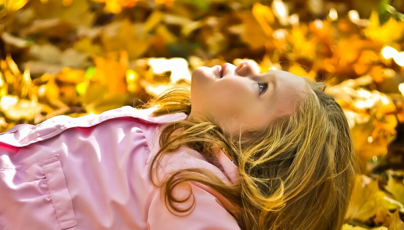 Girl Lying in Leaves — Yellow