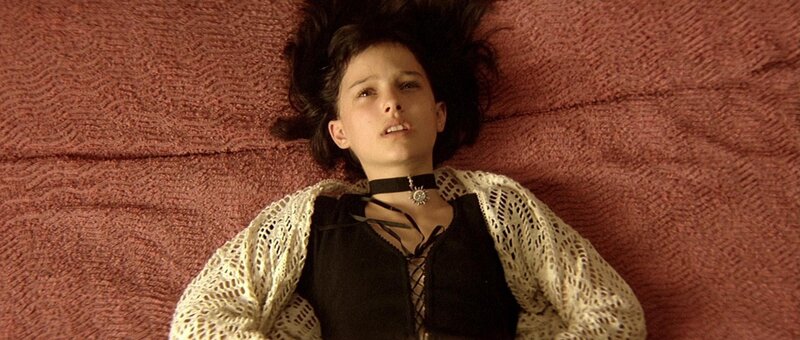 girl lying on a red surface
