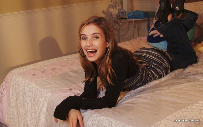 girl lying on bed smiling