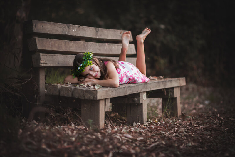 Girl Lying on Bench — Brown