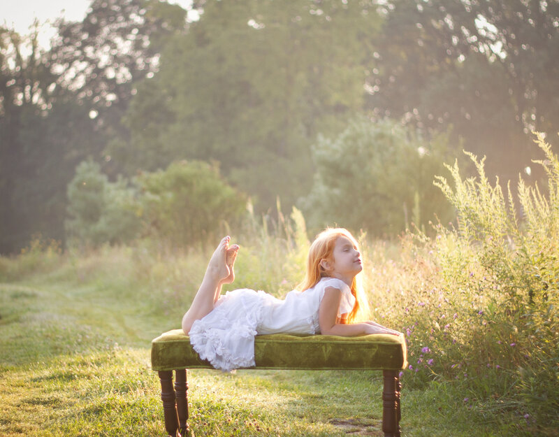 Girl Lying on Bench
