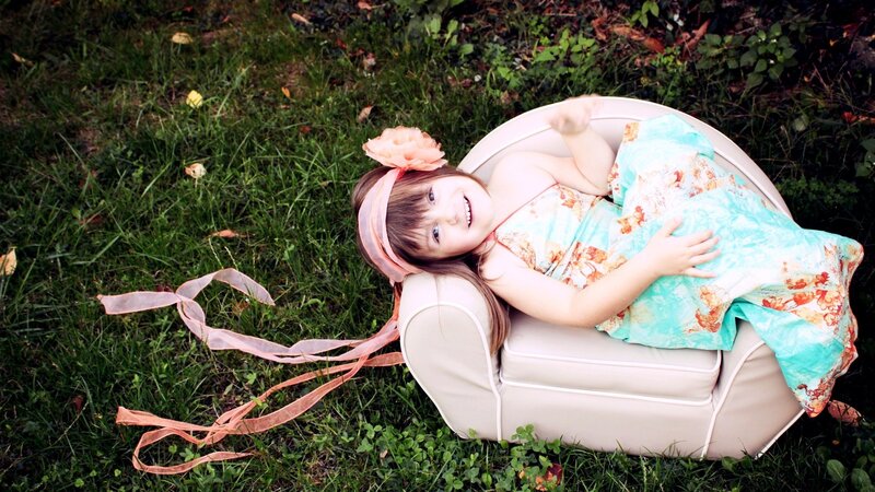 Girl Lying on Chair